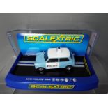 Scalextric - A Morris Mini Police Panda car in blue and white, # C3213.