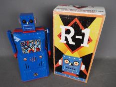 Rocket USA - Robot One, a tinplate battery powered bump and go vintage style robot from 2001.