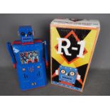 Rocket USA - Robot One, a tinplate battery powered bump and go vintage style robot from 2001.