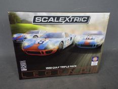 Scalextric - A limited edition 3 x car Ford GT40 Gulf Legends set. # C3896A.