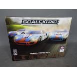 Scalextric - A limited edition 3 x car Ford GT40 Gulf Legends set. # C3896A.