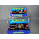 Scalextric - 2 x Lotus F1 Team cars, number 9 Kimi Raikkonen and number 10 Romain Grosjean.