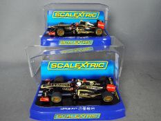 Scalextric - 2 x Lotus F1 Team cars, number 9 Kimi Raikkonen and number 10 Romain Grosjean.