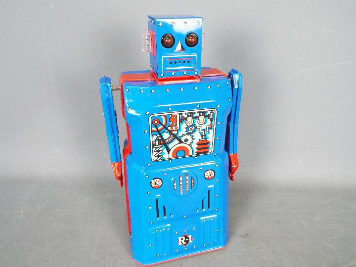 Rocket USA - Robot One, a tinplate battery powered bump and go vintage style robot from 2001. - Image 2 of 4