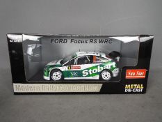 Sun Star - A boxed 1:18 scale Sun Satr 'Modern Rally Collectibles' #3916 Ford Focus RS WRC M.