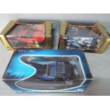 Bburago, Solido - Three boxed diecast model cars in 1:18 scale.