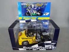 GB Track - SuperSlot - A Sisu racing truck and a 1:18 scale Telefonica Honda racing bike as ridden
