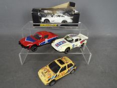 Scalextric - A group of four predominately unboxed Scalextric slot cars.