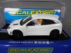 Scalextric - An unusual Ford Focus WRC model in plain white with several differences to the