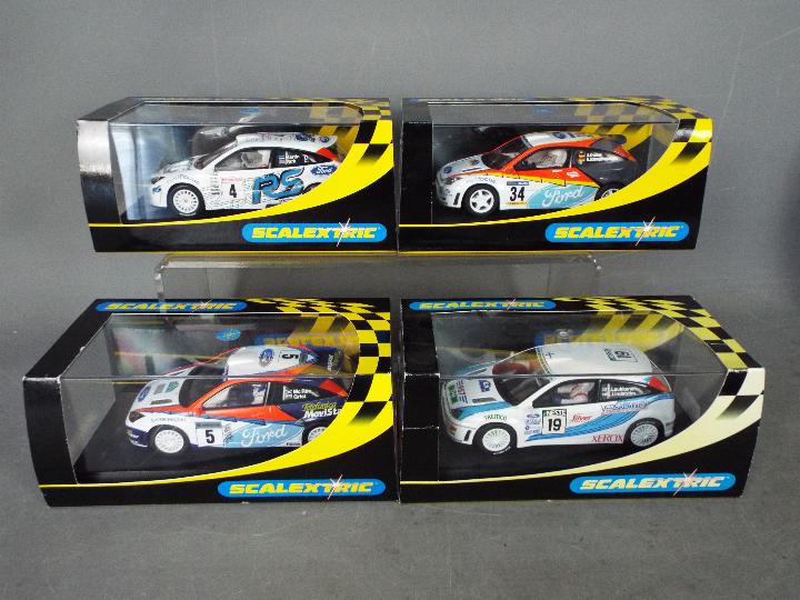 Scalextric - 4 x Ford Focus RS WRC models in different liveries including the number 5 McRae /