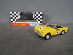 Scalextric - A vintage original 1960s Sunbeam Tiger racing car in yellow. # C.83.