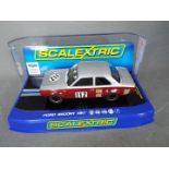 Scalextric - A 1969 Ford Escort MkI Broadspeed model in silver over maroon. # C3212.