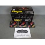 Onyx - A trade box of 24 diecast 1:43 scale diecast F1 racing cars.