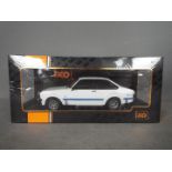 IXO - A boxed 1:18 scale diecast Ford #18CMC029 Ford Escort MK.II RS1800 1997 by IXO. Escort.