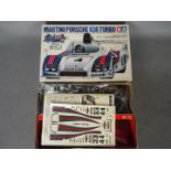 Tamiya - A boxed vintage Tamiya SS2404 1:24 scale Martini Porsche 936 Turbo plastic model kit.