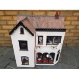 A scratch built wooden two storey dolls house.