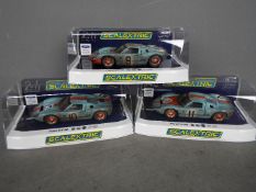 Scalextric - 3 x 1968 Ford GT40 Le Mans cars in Gulf livery in weathered finish, cars number 9,