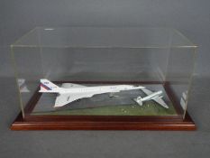 Unknown Maker - Cased diorama with a Tupolev TU-144 and a British United Airways Douglas C47 Dakota