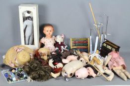 A quantity of doll parts including bodies,