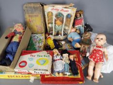 An eclectic collection of vintage dolls, toys and games.