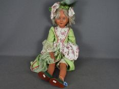A large jointed composite doll measuring approx.