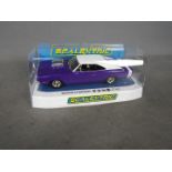 Scalextric - A boxed Dodge Charger R/T in purple. # C4148.