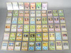 POKEMON - A collection of 57 Pokemon Base Set Cards.