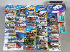 Hot Wheels - Over 32 carded Hot Wheels vehicles from various series together with three boxed