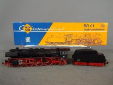 Roco - A boxed HO gauge class BR01 4-6-2 steam locomotive and tender Op.No.01147 in black DB livery.