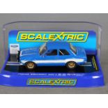 Scalextric - A Ford Escort Mk1 in blue with white stripes # C3592.