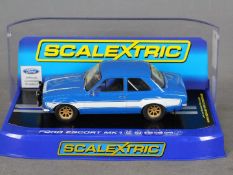 Scalextric - A Ford Escort Mk1 in blue with white stripes # C3592.