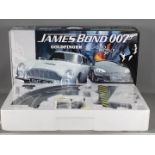 Scalextric - A James Bond 007 set # C1254 with Aston Martin DB5 Goldfinger car and Aston Martin DBS