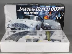 Scalextric - A James Bond 007 set # C1254 with Aston Martin DB5 Goldfinger car and Aston Martin DBS