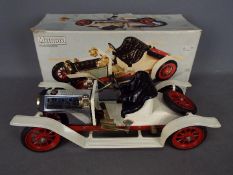 Mamod - a live steam model Roadster, white with black seats and red spoked wheels,