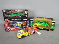 Racing Champions - A collection of 4 x American race cars in 1:24 scale,