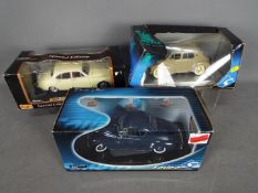 Solido, Maisto - Three boxed 1:18 scale diecast model cars.