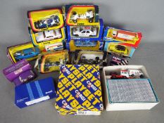 Corgi - A collection of 14 x boxed vehicles including # 59301 Ford Sierra rally car,