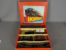 Hornby Train Set - an O Gauge tinplate, clockwork goods train set comprising 0-4-0 tank locomotive,
