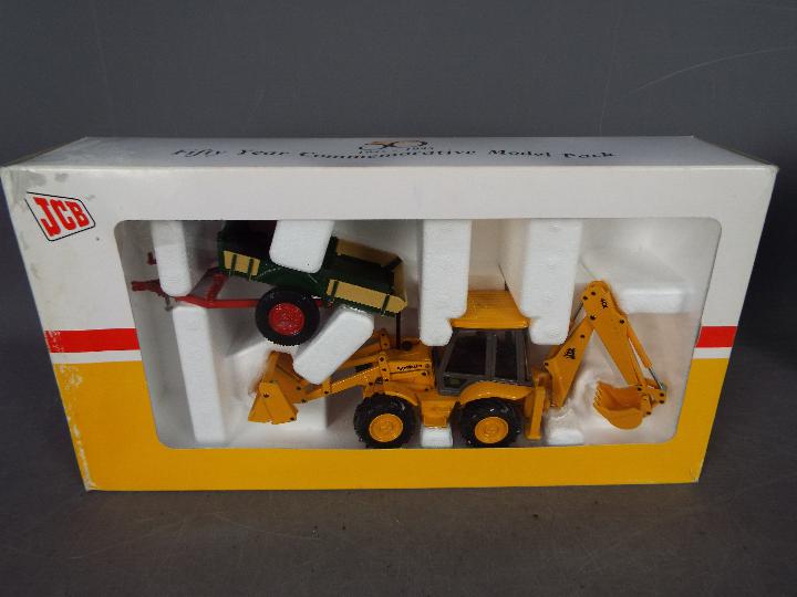 Joal - A boxed Limited Edition 'JCB 50 Years of Worldwide Service' set by Joal. - Image 2 of 4