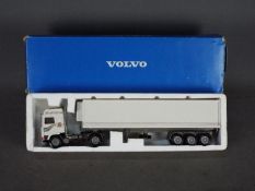 Conrad - A boxed 1:50 scale diecast Volvo F10 Fridge Trailer.