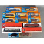 Roco, Jouef, Piko, Liliput - 12 boxed items of HO gauge passenger and freight rolling stock.