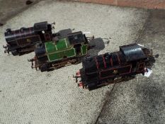Hornby - three unboxed O gauge tank locomotives, all 0-4-0T, green LNER and two black BR,