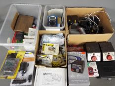 Model Railways - four boxes of OO gauge accessories to include transformers, control units,