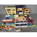 Corgi - Matchbox - Tomica - A group of x 18 boxed / carded vehicles in various scales including #