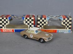 Scalextric - A vintage Mercedes 250 SL racing car in brown with a white top and number 1 racing