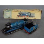 Chad Valley - an O Gauge tinplate, clockwork 4-4-0 locomotive with tender, BR blue livery,