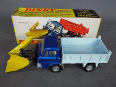 Dinky - A boxed # 439 Ford D800 tipper truck and snow plow.