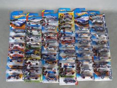 Hot Wheels - Approximately 50 carded Hot Wheels majority from the Hot Wheels HW Racing series some