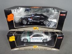 Maisto - two 1:18 scale diecast vehicles by Maisto both Mercedes-Benz CLK-DTM 2000 with showroom
