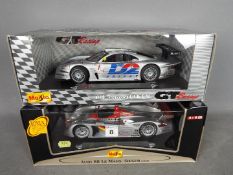 Maisto - two 1:18 scale diecast model vehicles by Maisto comprising Audi R8 Le Mans-Sieger (2000)